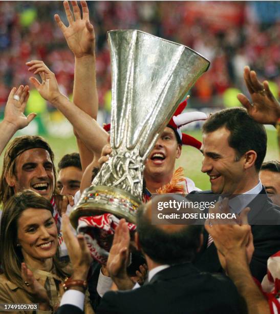 Spain's Prince Felipe and wife Letizia jubilate with Sevilla players after they won the UEFA cup final football match Middlesbrough vs. FC Sevilla,...