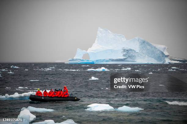 Exploring with Zodiac amoungst icebergs in Portal Point Antarctic Peninsula Antarctica. The RCGS Resolute One Ocean Navigator, a five star polar...