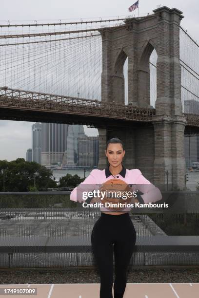 Kim Kardashian poses at the announcement of SKIMS being named the official underwear partner of the NBA, WNBA, and USA Basketball on September 28,...