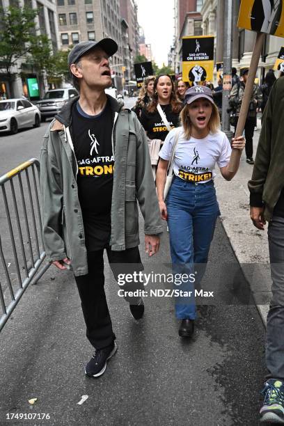 David Hyde Pierce and AnnaSophia Robb walk a picket line outside Warner Bros. Discovery Headquarters on October 27, 2023 in New York City.