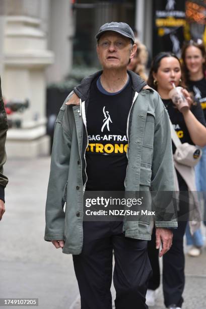 David Hyde Pierce walks a picket line outside Warner Bros. Discovery Headquarters on October 27, 2023 in New York City.