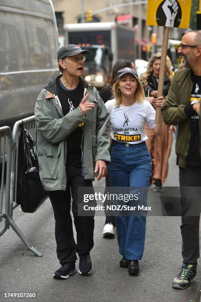 David Hyde Pierce and AnnaSophia Robb walk a picket line outside Warner Bros. Discovery Headquarters on October 27, 2023 in New York City.