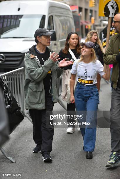 David Hyde Pierce and AnnaSophia Robb walk a picket line outside Warner Bros. Discovery Headquarters on October 27, 2023 in New York City.