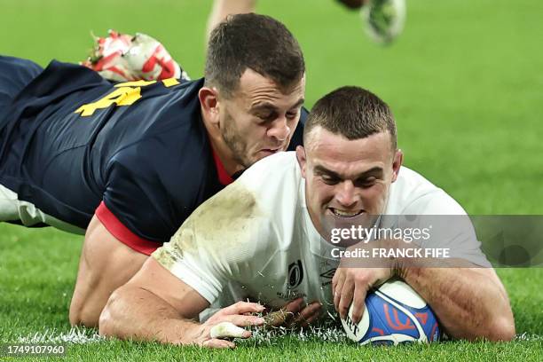 England's number eight Ben Earl scores a try as he is tackled by Argentina's right wing Emiliano Boffelli during the France 2023 Rugby World Cup...