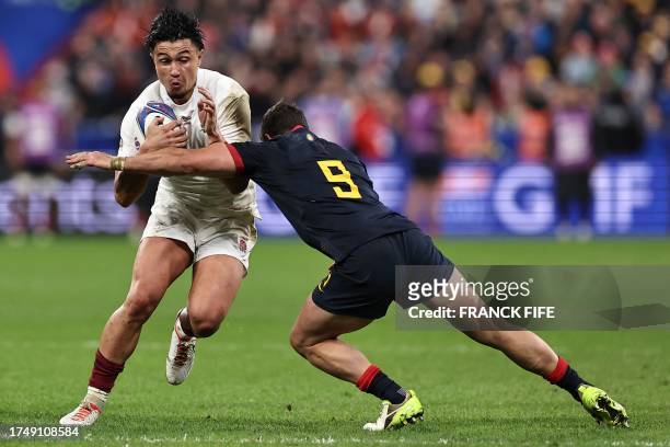 England's full-back Marcus Smith is tackled by Argentina's scrum-half Tomas Cubelli during the France 2023 Rugby World Cup third-place match between...