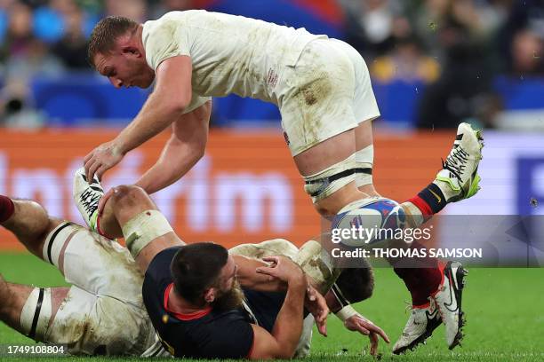 Argentina's openside flanker Marcos Kremer is tackled by England's blindside flanker Tom Curry and England's openside flanker Sam Underhill during...