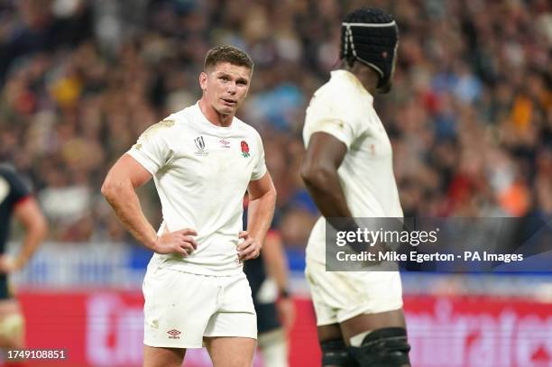 England's Owen Farrell speaks with team mate Maro Itoje during the Rugby World Cup 2023 bronze final match at the Stade de France in Saint-Denis,...