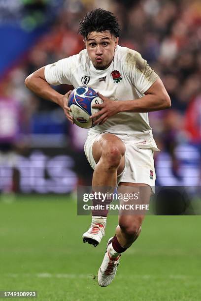 England's full-back Marcus Smith runs with the ball during the France 2023 Rugby World Cup third-place match between Argentina and England at the...