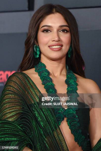 Bollywood actress Bhumi Pednekar poses upon her arrival for the opening ceremony of "Jio MAMI Mumbai Film Festival 2023" in Mumbai on October 27,...