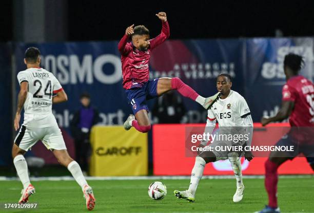 Clermont-Ferrand's Gabonese forward Jim Allevinah shoots the ball during the French L1 football match between Clermont Foot 63 and OGC Nice at Stade...