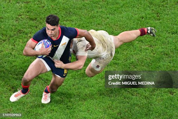 Argentina's fly-half Santiago Carreras breaks away to score a try during the France 2023 Rugby World Cup third-place match between Argentina and...