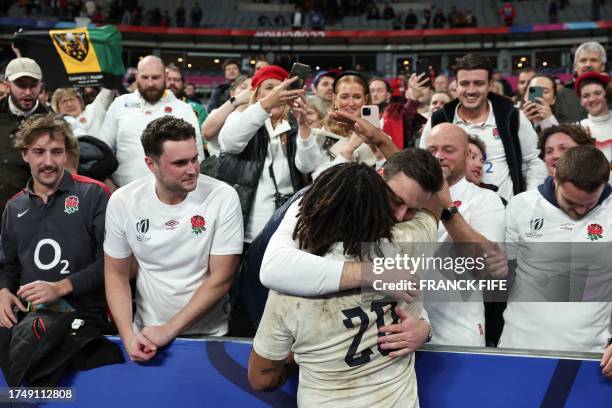 England's flanker Lewis Ludlam celebrates with supporters after winning the France 2023 Rugby World Cup third-place match between Argentina and...