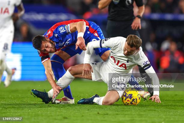 Joel Ward of Crystal Palace catches the sock of James Maddison of Tottenham Hotspur with his studs during the Premier League match between Crystal...