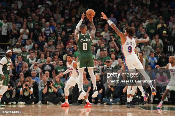 Damian Lillard of the Milwaukee Bucks shoots a three point basket against the Philadelphia 76ers on October 26, 2023 at the Fiserv Forum Center in...