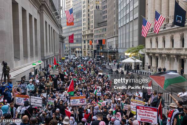 Supporters of Palestine march through lower Manhattan during a rally held in support of Palestinians in Gaza. The protest was against manufacturers...