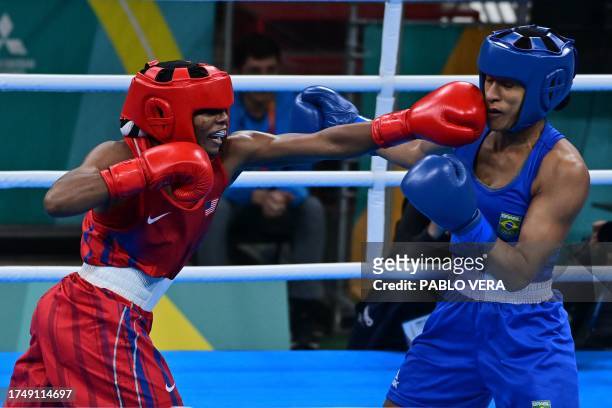 Brazil's Barbara Dos Santos and USA's Morelle McCane exchange blows during the boxing women's 66kg finals of the Pan American Games Santiago 2023 at...