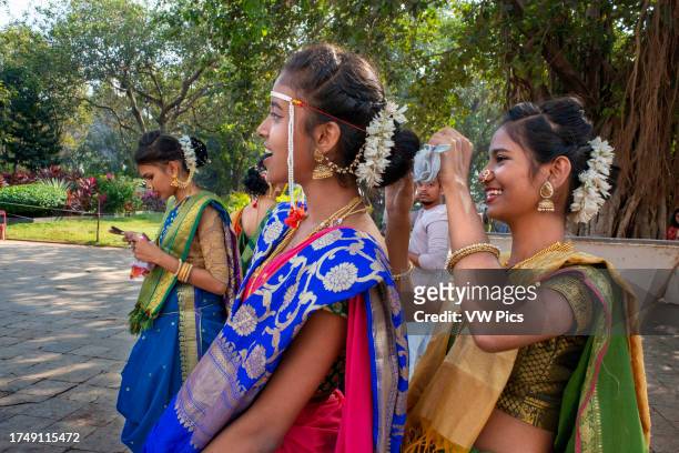 Women with typical saris walking in Cross Maidan Garden in colonial district area Mumbai city maharashtra India Asia.