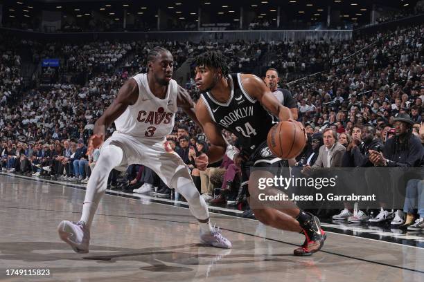 Cam Thomas of the Brooklyn Nets dribbles the ball during the game against Caris LeVert of the Cleveland Cavaliers on October 25, 2023 at Barclays...