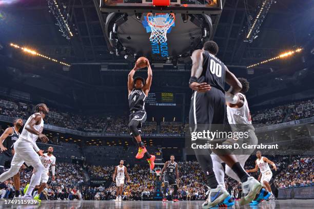 Dennis Smith Jr. #4 of the Brooklyn Nets grabs a rebound during the game against the Cleveland Cavaliers on October 25, 2023 at Barclays Center in...