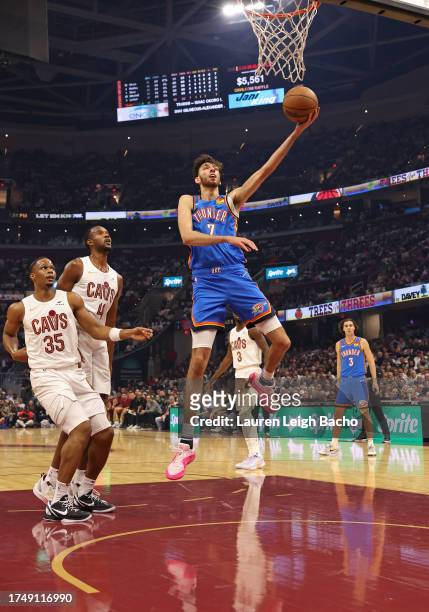 Chet Holmgren of the Oklahoma City Thunder drives to the basket during the game against the Cleveland Cavaliers on October 27, 2023 at Rocket...