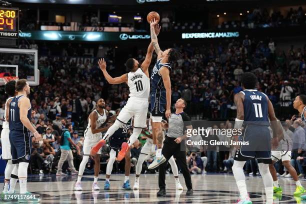 Ben Simmons of the Brooklyn Nets and Dereck Lively II of the Dallas Mavericks go up for a jump ball on October 27, 2023 at the American Airlines...