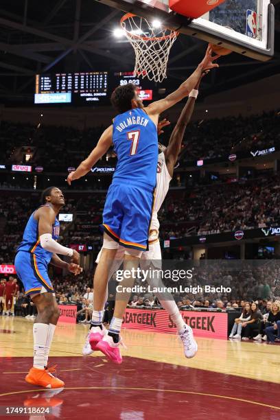 Chet Holmgren of the Oklahoma City Thunder block during the game against the Cleveland Cavaliers on October 27, 2023 at Rocket Mortgage FieldHouse in...