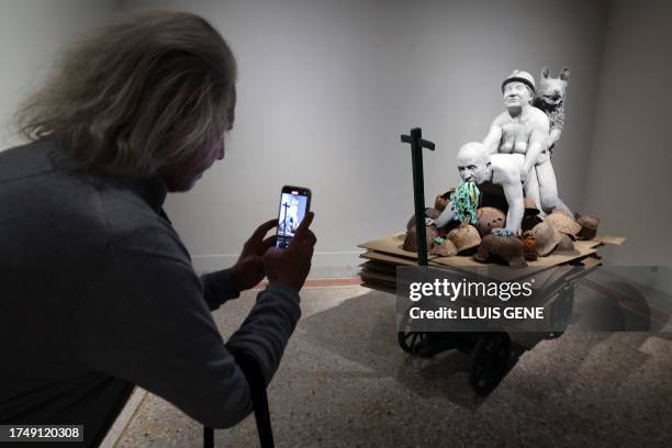 Visitors looks at "Not dressed for conquering / HC04 Transport" by Austrian artist Ines Doujak, at the Forbidden Art Museum in Barcelona on October...