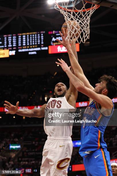 Evan Mobley of the Cleveland Cavaliers drives to the basket during the game against the Oklahoma City Thunder on October 27, 2023 at Rocket Mortgage...