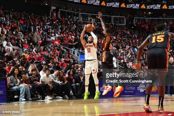 Jalen Brunson of the New York Knicks shoots a thee point shot during the game against the Atlanta Hawks on October 27, 2023 at State Farm Arena in...