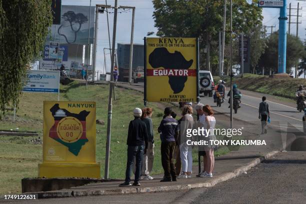 Tourists visit the point of the equator crossing that is a popular attraction to Nanyuki town in Laikipia county on October 17, 2023.