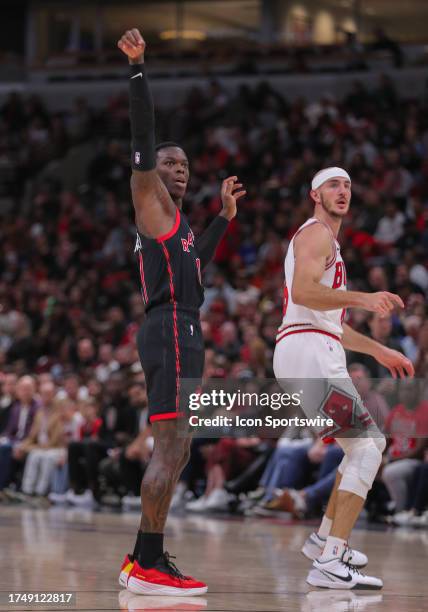 Toronto Raptors guard Dennis Schroder looks on after making a 3-point basket during a NBA game between the Toronto Raptors and the Chicago Bulls on...