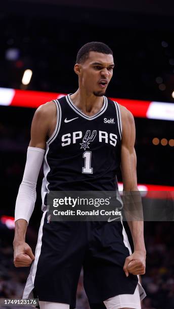 Victor Wembanyama of the San Antonio Spurs celebrates after scoring against the Houston Rockets in overtime at Frost Bank Center on October 27, 2023...