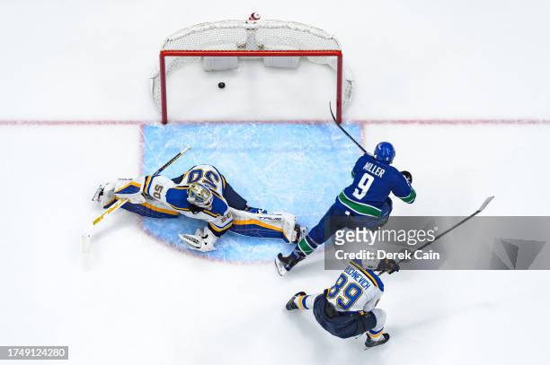 Miller of the Vancouver Canucks scores a goal on Jordan Binnington of the St. Louis Blues during the second period of their NHL game at Rogers Arena...