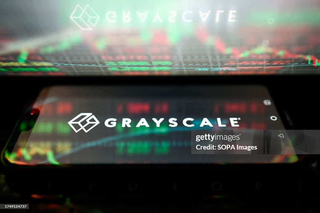 In this photo illustration, Grayscale logo is displayed on a...