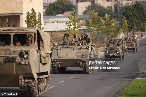 Israeli tanks and troops move near the border with Gaza on October 28, 2023 in Sderot, Israel. In the wake of the Oct. 7 attacks by Hamas that left...