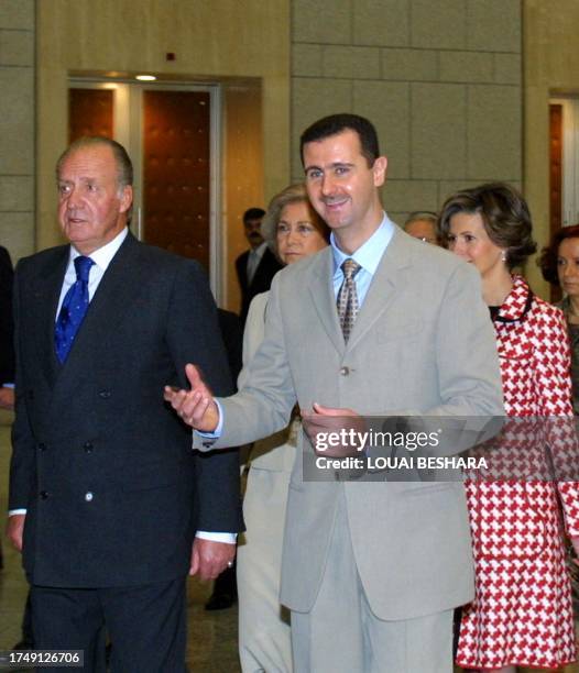 Syrian President Bashar al-Assad and his wife Asma receive King Juan Carlos and Queen Sofia of Spain at al-Shaab Palace, in Damascus 20 October 2003....