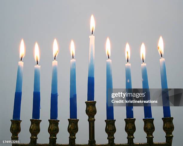 menorah on gray - blue candle stock pictures, royalty-free photos & images