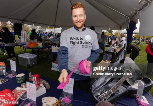 Participants come out to walk and support during American Foundation for Suicide Prevention Out of the Darkness Chicagoland Walk at Montrose Harbor...