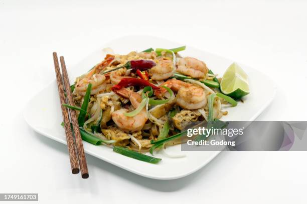 The classic Thai dish Pad Thai, consisting of fried noodles with shrimps, bean sprouts, fried tofu, crushed peanuts and spring onion.