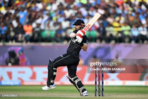 New Zealand's Daryl Mitchell plays a shot during the 2023 ICC Men's Cricket World Cup one-day international match between Australia and New Zealand...