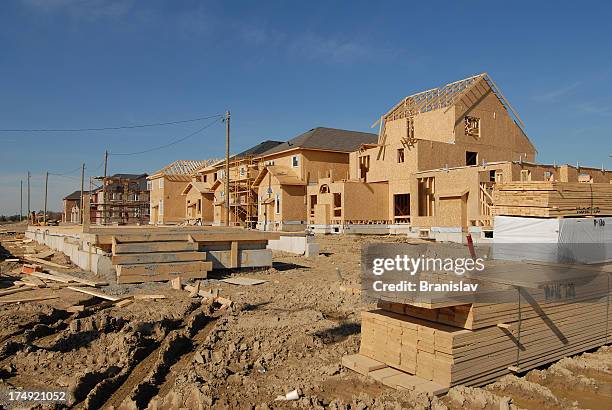 a wooden house under construction - housing subdivision stock pictures, royalty-free photos & images