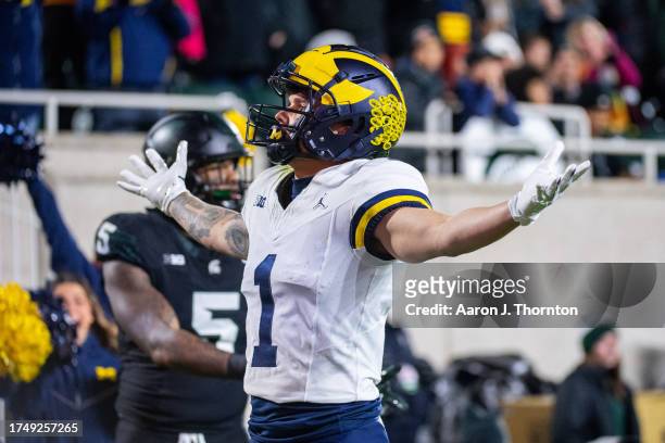 Roman Wilson of the Michigan Wolverines reacts after scoring a touchdown during the first half of a college football game against the Michigan State...