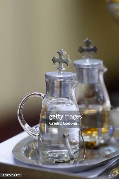 Sunday mass. Eucharist celebration. Eucharist table with the liturgical items. Cruets with vine and water. Roman catholic church. Ho Chi Minh City....