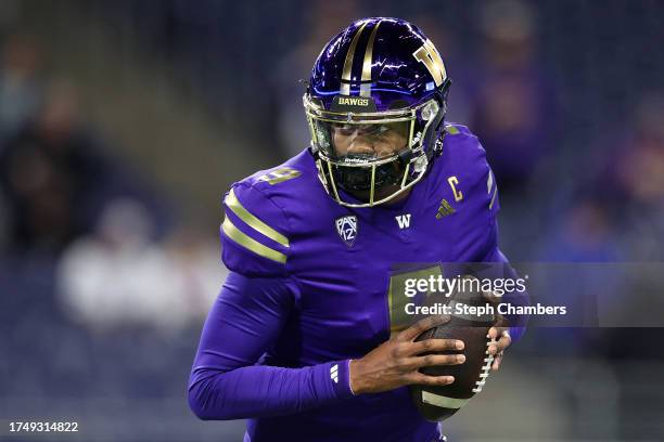 Michael Penix Jr. #9 of the Washington Huskies warms up before the game against the Arizona State Sun Devils at Husky Stadium on October 21, 2023 in...