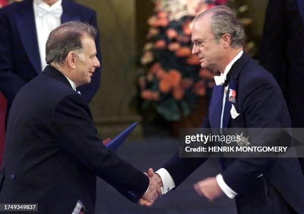 Doctor Zhores I. Alferov, left, receives the Nobel Prize in physics from Swedish King Carl XVI Gustaf, right, at the Concert Hall in Stockholm, 10...
