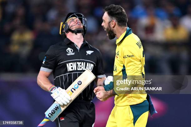 Australia's Glenn Maxwell celebrates after taking the wicket of New Zealand's Glenn Phillips during the 2023 ICC Men's Cricket World Cup one-day...