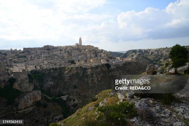 View of Matera. Matera is a city located on a rocky outcrop. The so-called area of the Sassi is a complex of cave houses carved into the rock,...