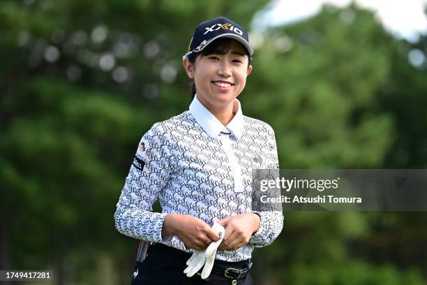 Nana Suganuma of Japan smiles on the 10th tee during the final round of NOBUTA Group Masters GC Ladies at Masters Golf Club on October 22, 2023 in...