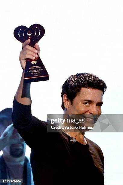 Chayanne, winner of the iHeartRadio Corazón Latino Award, speaks onstage during the 2023 iHeart Fiesta Latina at Kaseya Center on October 21, 2023 in...