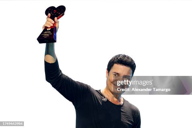 Chayanne, winner of the iHeartRadio Corazón Latino Award, speaks onstage during the 2023 iHeart Fiesta Latina at Kaseya Center on October 21, 2023 in...
